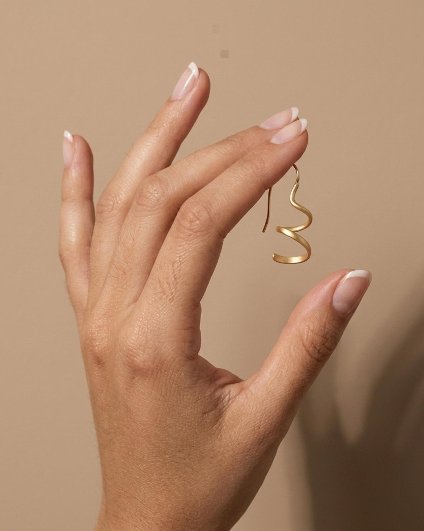 VERA Waterproof 18K Gold Plated Mini Spinning Earring – Sanded Stainless Steel - DANSK Copenhagen